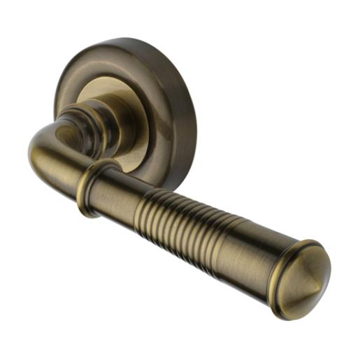 Colonial Reeded Lever on Round Rose Antique Brass